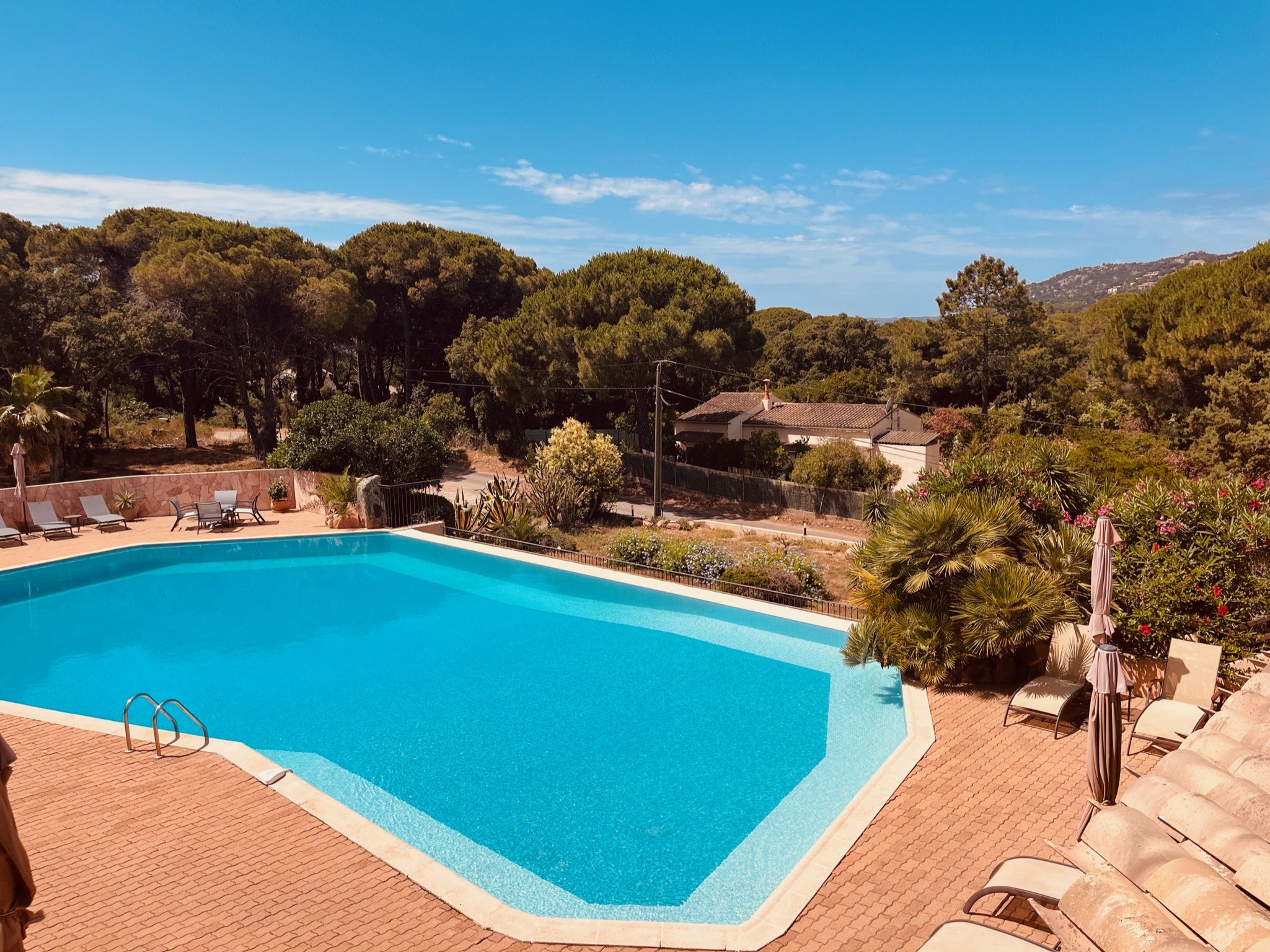 The swimming pool of the hotel from the apartment